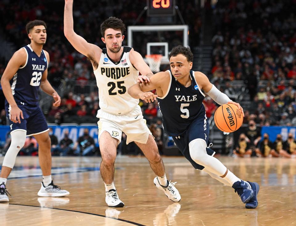 Yale guard Azar Swain, of Brockton, drives to the basket as Purdue Boilermakers guard Ethan Morton defends during the second half in the first round of the 2022 NCAA Tournament at Fiserv Forum in Milwaukee on Friday, March 18, 2022.