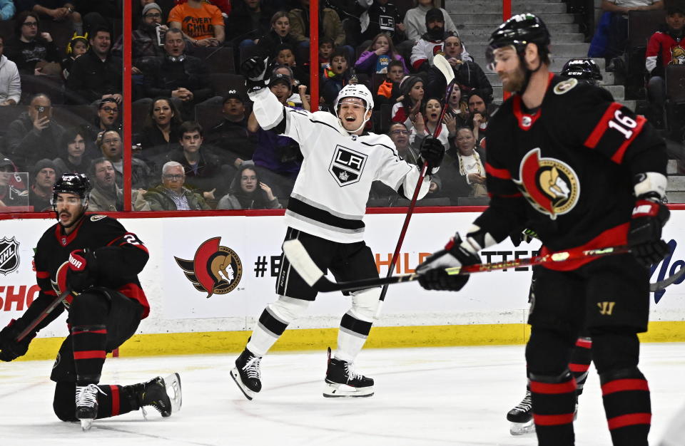 Los Angeles Kings defenseman Mikey Anderson celebrates scoring on Ottawa Senators goaltender Cam Talbot, as defenseman Travis Hamonic and left wing Austin Watson (16) look on, during the first period of an NHL hockey game, Tuesday, Dec. 6, 2022, in Ottawa, Ontario. (Justin Tang/The Canadian Press via AP)