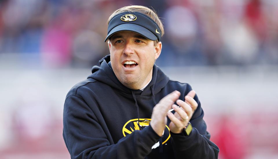 FAYETTEVILLE, ARKANSAS - NOVEMBER 24: Head Coach Eli Drinkwitz of the Missouri Tigers watches his team warm up before the game against the Arkansas Razorbacks at Donald W. Reynolds Razorback Stadium on November 24, 2023 in Fayetteville, Arkansas. (Photo by Wesley Hitt/Getty Images)