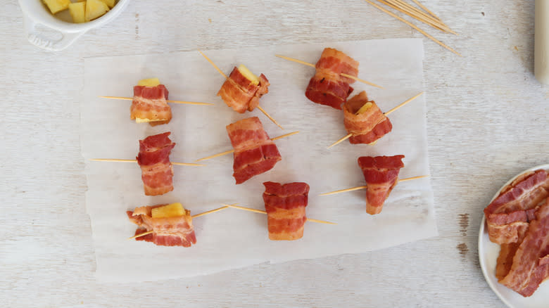 pineapple wrapped bacon on skewers