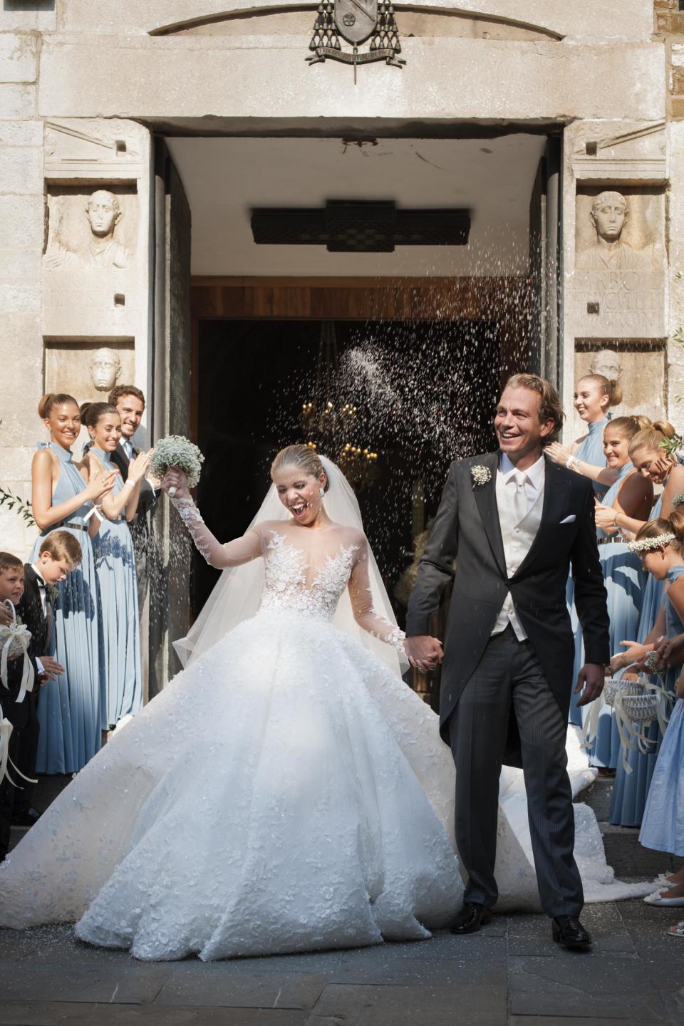 Victoria Swarovski and Werner Muerz exit the church after their wedding. (Chris Singer/Getty Images)
