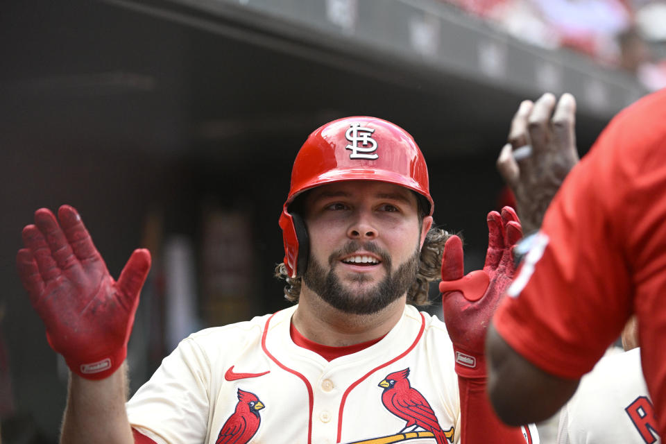 St. Louis Cardinals' Alec Burleson is congratulated after hitting a two-run home run in the sixth inning of a baseball game against the San Francisco Giants, Saturday June 22, 2024, in St. Louis. (AP Photo/Joe Puetz)