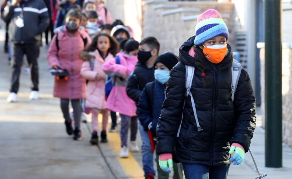 Masked students walk into the Church Street Elementary School in White Plains on March 2, 2022. New York State's indoor mask mandate for schools was lifted on March 2, and staff and students had the option to not wear masks for the first time since the start of the COVID-19 pandemic.
