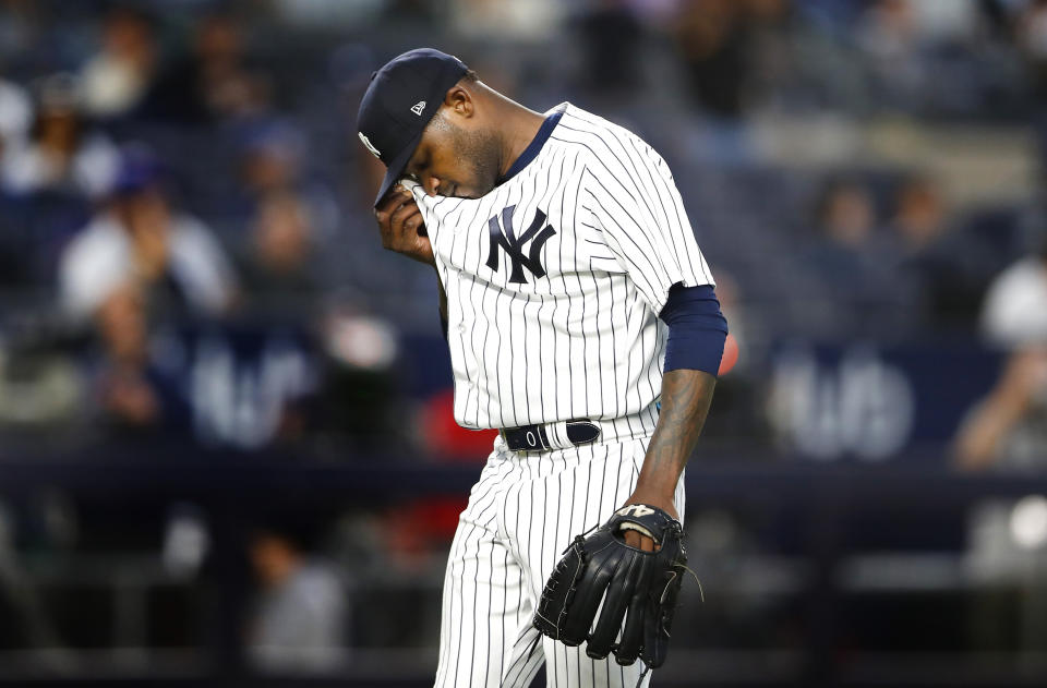 New York Yankees starting pitcher Domingo German wipes his face after pitching during the fourth inning of a baseball game against the Seattle Mariners, Thursday, June 22, 2023, in New York. (AP Photo/Noah K. Murray)