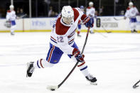 Montreal Canadiens right wing Cole Caufield shoots against the New York Rangers in the third period of an NHL hockey game Sunday, Jan. 15, 2023, in New York. (AP Photo/Adam Hunger)