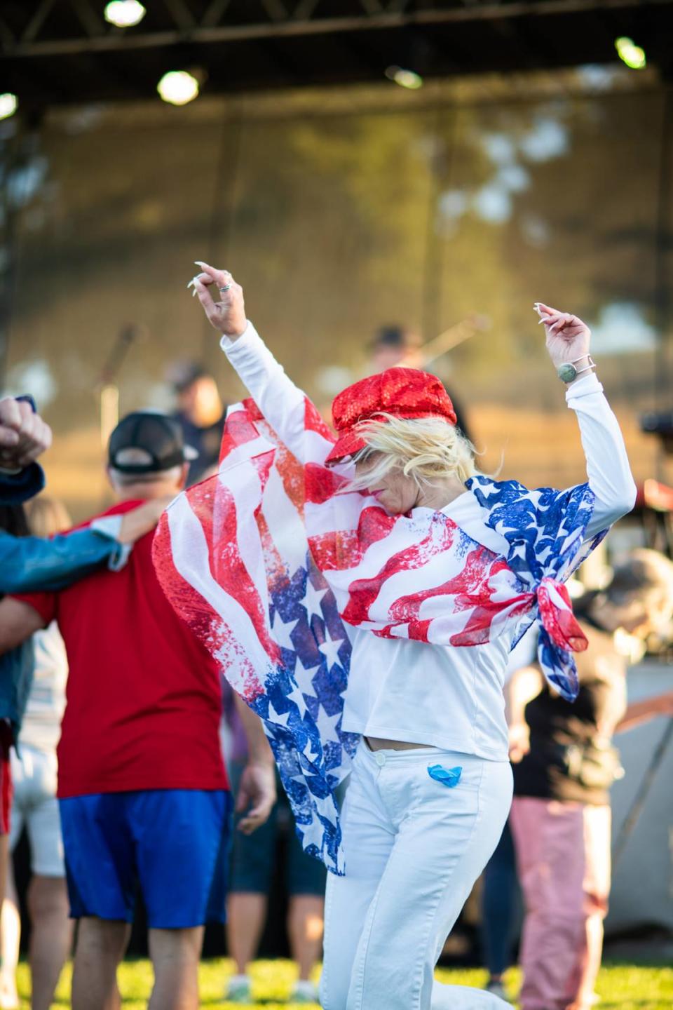 A woman dances to live music at Paso Robles’ Fourth of July celebration held at Barney Schwartz Park, on July 4, 2023.