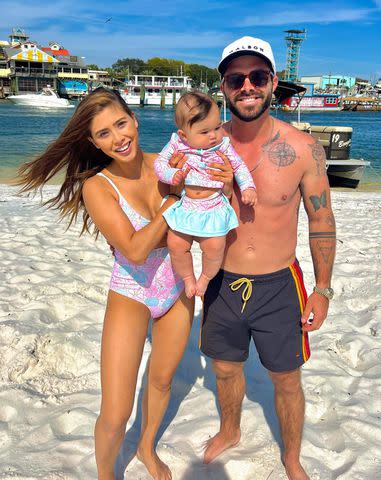 <p>April Marie/Instagram</p> April Marie Melohn and Cody Cooper with their daughter Mila.