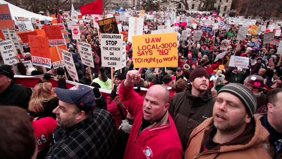 Union members rally at the Michigan State Capitol in 2012 to protest a vote on right-to-work legislation. The National Right to Work Committee and the American Legislative Exchange Council both promote "right to work" model legislation.