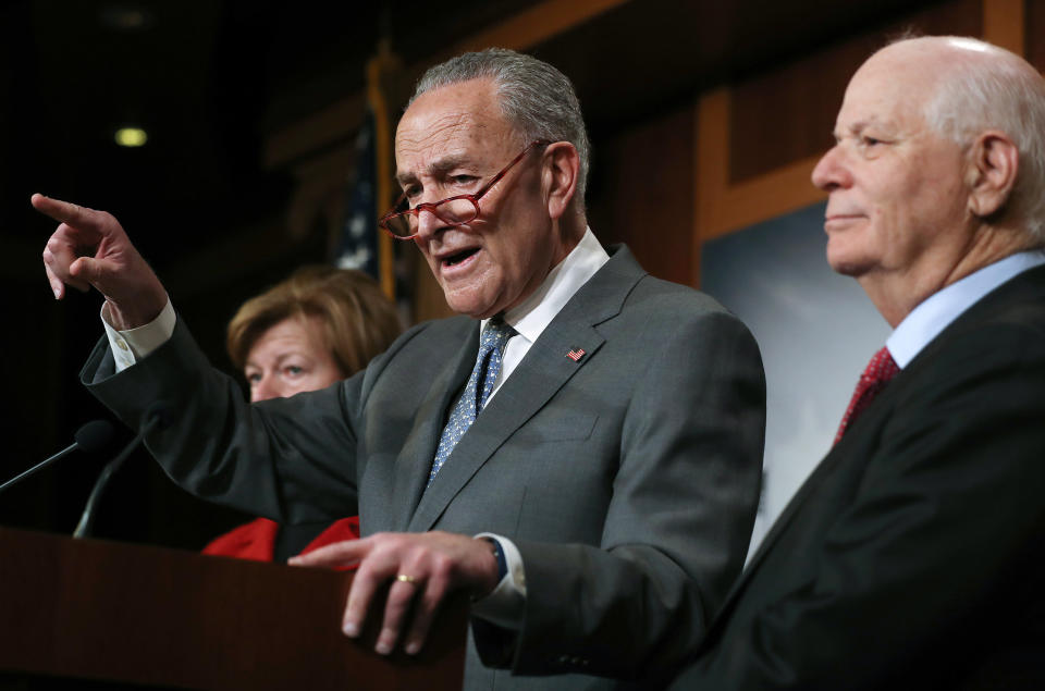 Senate Minority Leader Chuck Schumer speaks as Sen. Ben Cardin (right) and Sen. Tammy Baldwin (left) look on at a news conference at the U.S. Capitol on Jan. 27 in Washington, D.C. (Photo: Mario Tama via Getty Images)