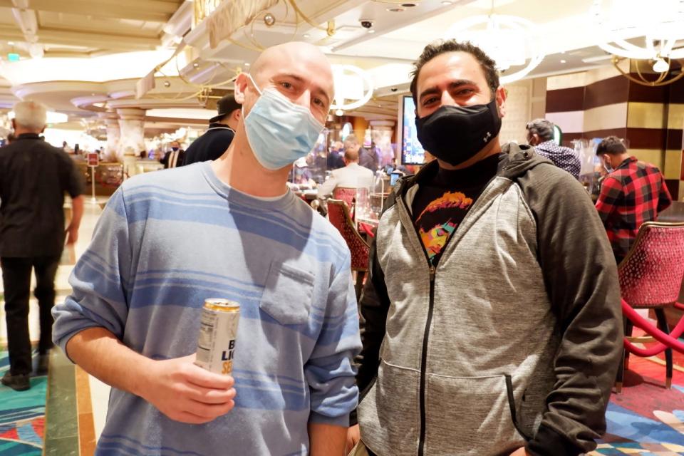 Daniel Erskine, left, did not get the COVID-19 vaccine, but he said that wasn't going to stop him from visiting Las Vegas.