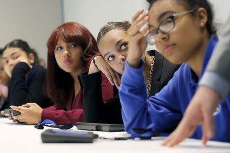 High school students from the City on a Hill Charter Public School play the role of U.S. senators as they work to pass an immigration reform bill during a mock legislative session of the U.S. Senate chamber at the Edward M. Kennedy Institute in Boston, Massachusetts June 10, 2015. REUTERS/Brian Snyder