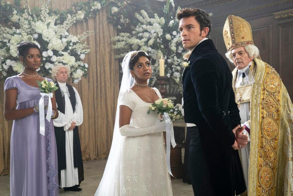 Simone Ashley as Kate Sharma, Charithra Chandran as Edwina Sharma, Jonathan Bailey as Anthony Bridgerton, Anthony Wise as Archbishop in episode 206 of "Bridgerton" (Liam Daniel/Netflix)