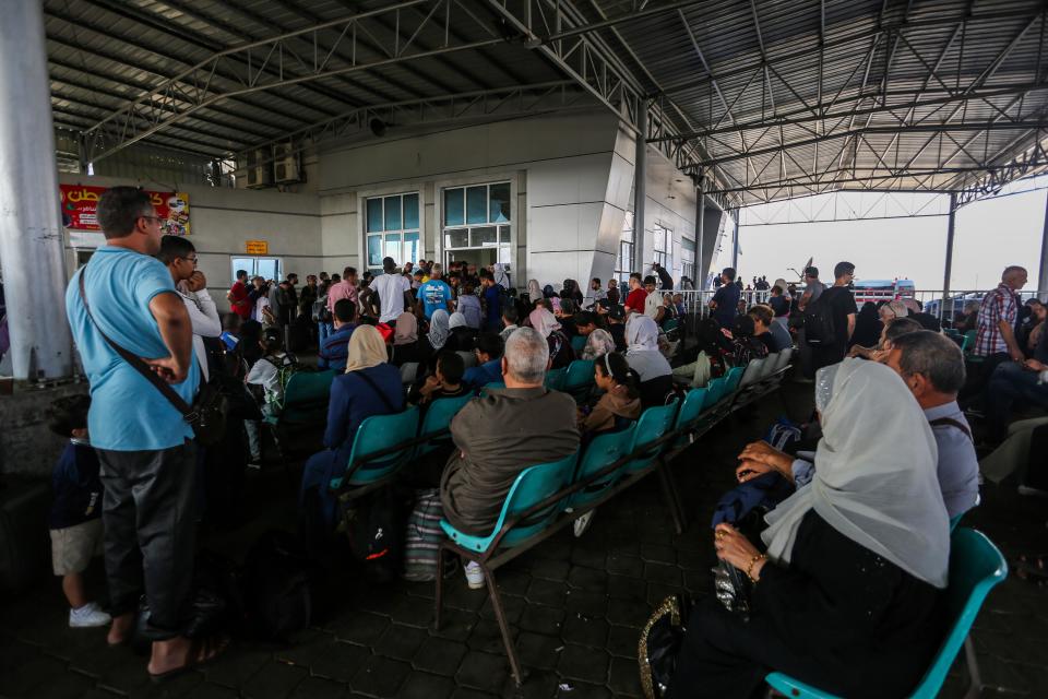 Citizens with foreign passports wait to travel through the Rafah crossing on Nov. 2, 2023, in Rafah, Gaza.