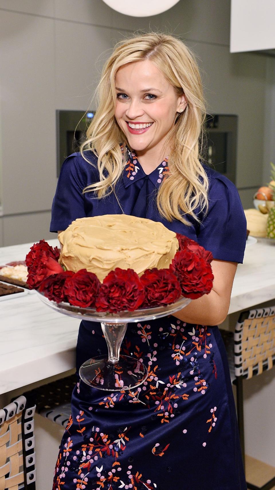 Reese Witherspoon with a cake