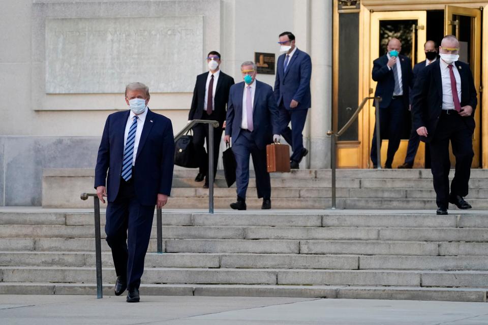 <p>Donald Trump walks out of Walter Reed medical centre following his hospitalisation from the coronavirus.</p>AP