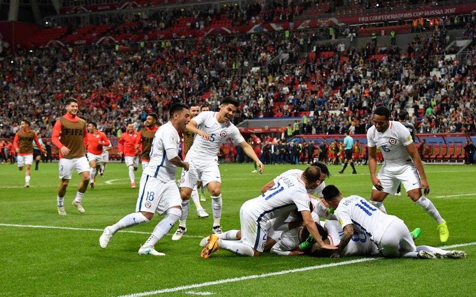 Chile players celebrate winning the penalty shootout - Credit: GETTY IMAGES