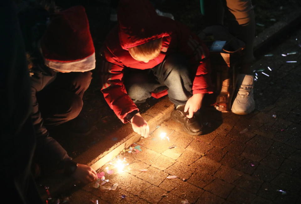 Children light sparklers during New Year celebrations. Source: Getty