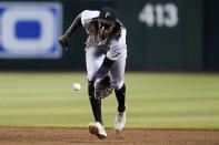 Pittsburgh Pirates shortstop Oneil Cruz fields a ground ball hit by Arizona Diamondbacks' Alek Thomas before throwing to first base for an out during the third inning of a baseball game Thursday, Aug. 11, 2022, in Phoenix. (AP Photo/Ross D. Franklin)