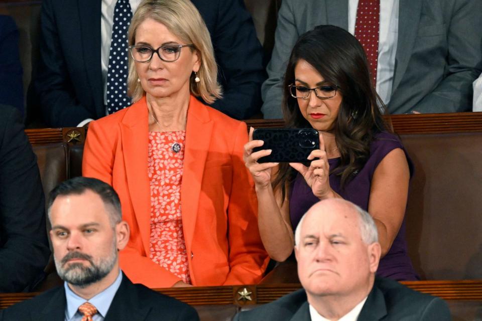 PHOTO: Representative Lauren Boebert takes a photo as Israeli President Isaac Herzog addresses a Joint Meeting of Congress in the House Chamber of the U.S. Capitol in Washington on July 19, 2023. (Andrew Caballero-reynolds/AFP via Getty Images)