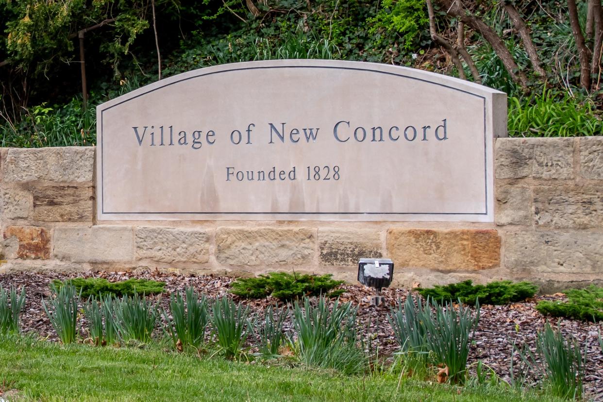 The Village of New Concord sign welcomes guests to the area.