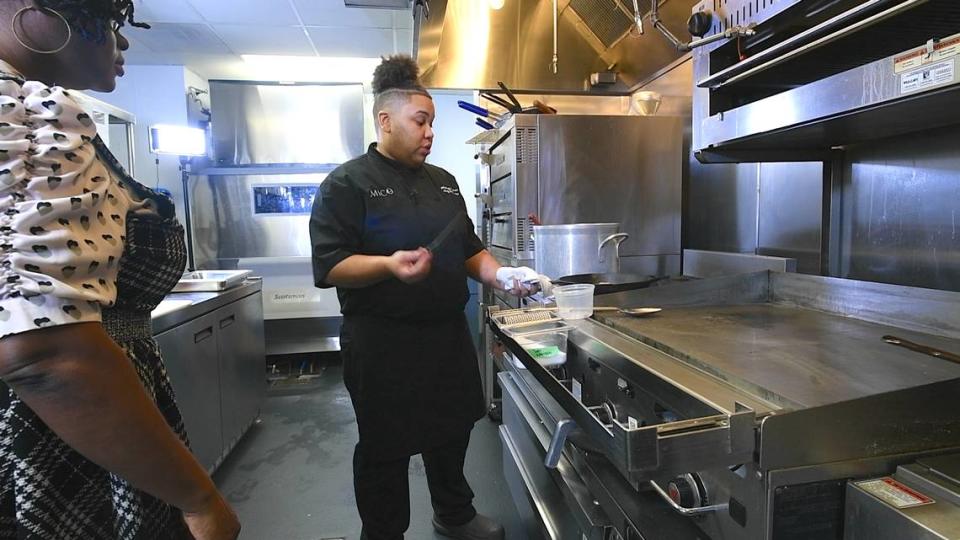 Chef Whitney Thomas shows CharlotteFive reporter Emiene Wright how she makes Feijoada in February 2021. Thomas and Wright were filming the CharlotteFive mini series, “The Skillet: How Black Cuisine Became America’s Supper.”