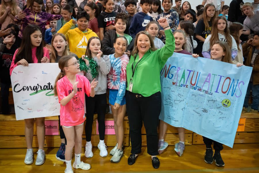 Jessica McMullen stands by students (Photo provided by H-E-B). 