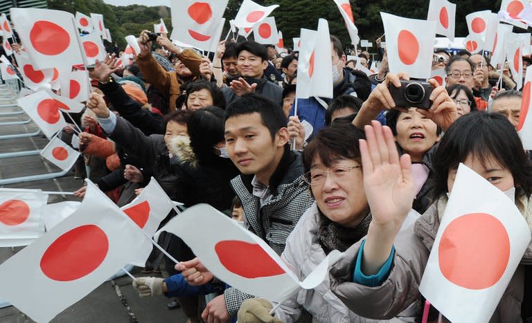 Supporters celebrate the birthday of Emperor Akihito at the Imperial Palace in Tokyo on December 23, 2012. The Japanese throne is held in deep respect by much of the public, despite being stripped of much of its mystique and its quasi-divine status in the aftermath of World War II