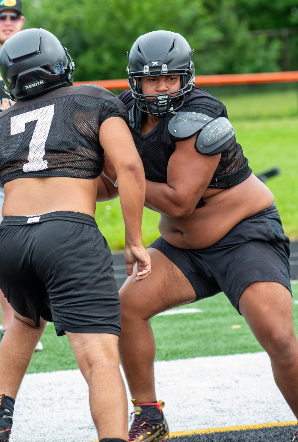 Defensive lineman Keshawn Harrington-McKinney, right, pushes off of Isaac Johnson during practice on Friday, Aug. 12, 2022.
