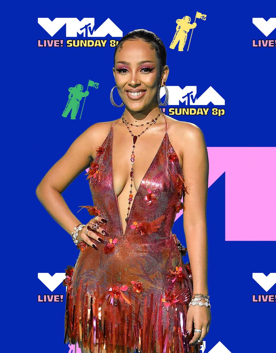 Doja Cat in Ofira jewelry and Lorraine Schwartz studs