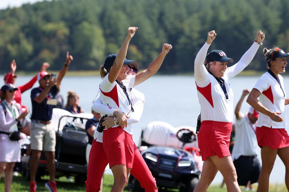 Captain for Team United States Stacy Lewis reacts with Assistant captains Paula Creamer and Brittany Lincicome after Team United States wins the Solheim Cup during the Sunday Singles matches during the final round of the Solheim Cup 2024 at Robert Trent Jones Golf Club on September 15, 2024 in Gainesville, Virginia. (Photo by Gregory Shamus/Getty Images)