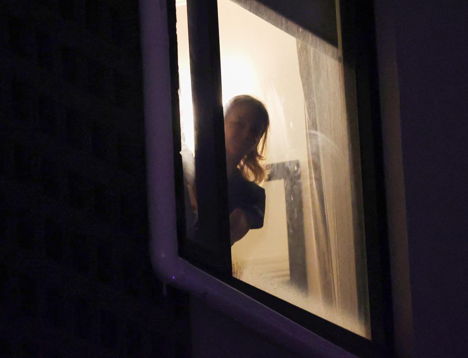Renata Voracova, pictured here looking out the window at a Melbourne quarantine hotel.