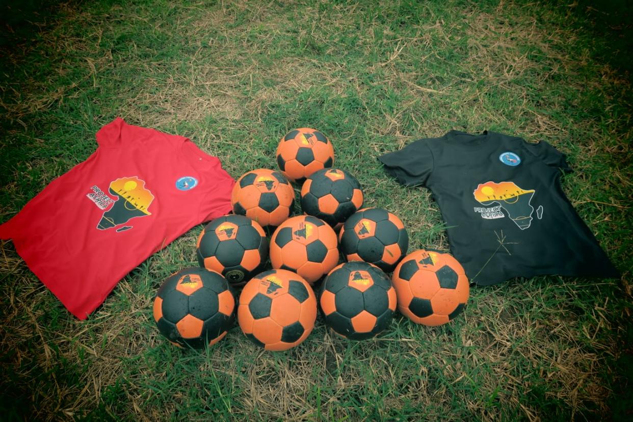 T-shirts and footballs with the logo for Project Africa 