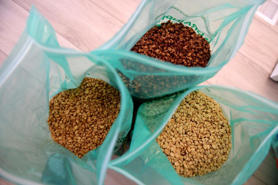 Three types of coffee beans are bagged during the aging process at Rancho Filoso in Santa Paula Sept. 20.