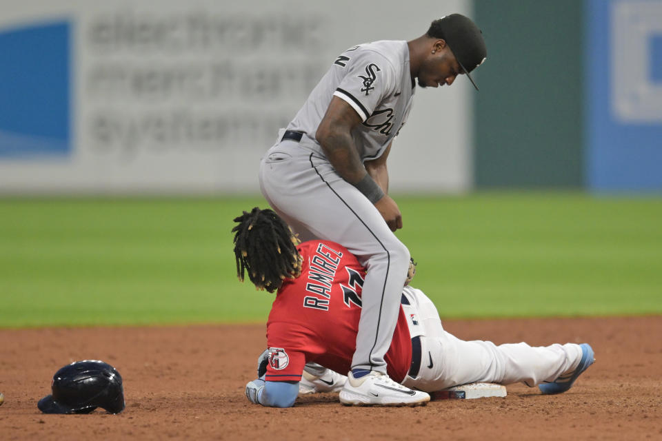 Aug 5, 2023; Cleveland, Ohio, USA; Chicago White Sox shortstop Tim Anderson (7) stands over Cleveland Guardians third baseman Jose Ramirez (11) after Ramirez slid into second with an RBI double during the sixth inning at Progressive Field. Mandatory Credit: Ken Blaze-USA TODAY Sports