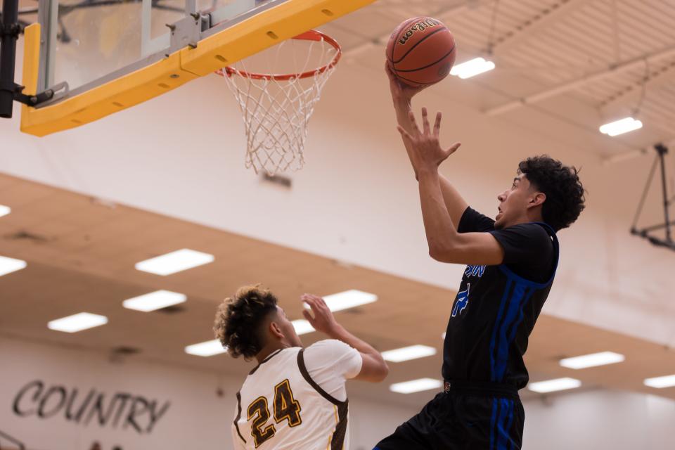 Harmony Science Academy's Edgar Dominguez shoots the ball at a boys basketball game against Austin Tuesday, Feb. 7, 2023, at Austin High School in El Paso, TX.