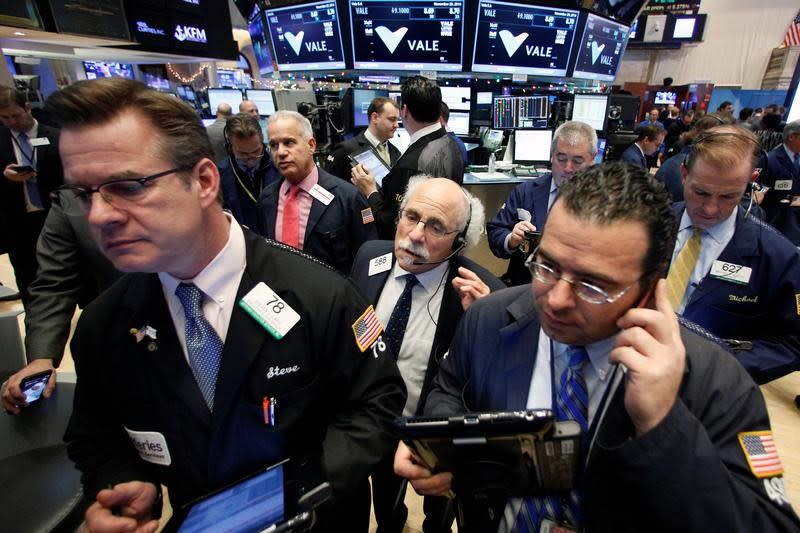 Traders work on the floor of the New York Stock Exchange (NYSE) in New York City, U.S., November 29, 2016. REUTERS/Brendan McDermid