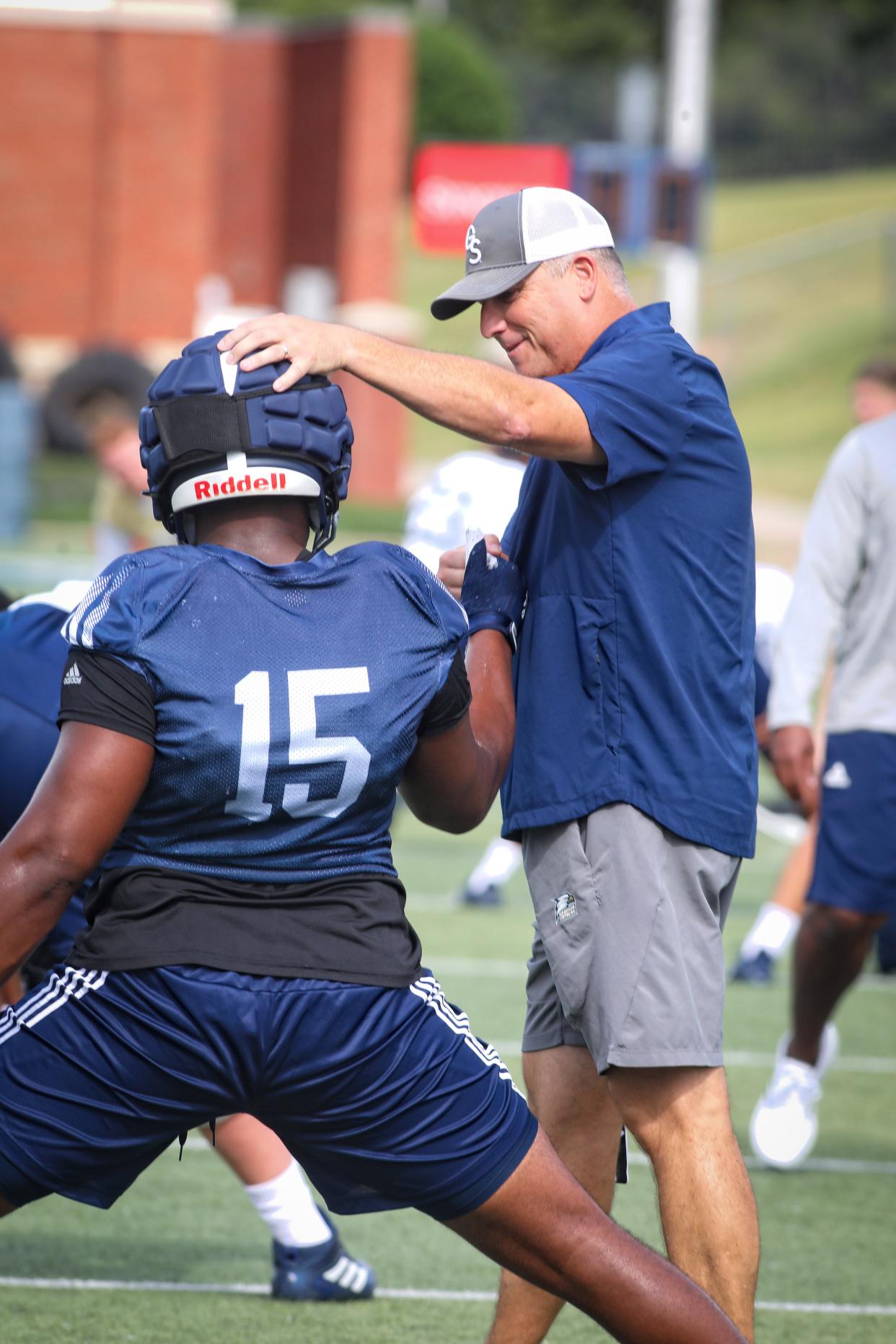 Georgia Southern's new head coach Clay Helton greets defensive lineman Quin Williams (15) on the first day of fall practice on Aug. 3, 2022 at Paulson Stadium in Statesboro.