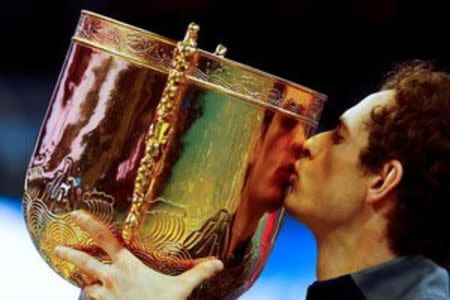 Tennis - China Open men's singles final - Beijing, China - 09/10/16. Britain's Andy Murray kisses his trophy after defeating Bulgaria's Grigor Dimitrov. REUTERS/Thomas Peter