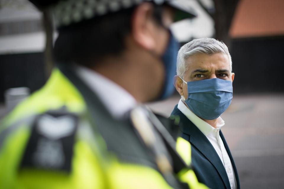 Labour’s Mayor of London Sadiq Khan looks across to a Metropolitan Police officer (PA Wire)