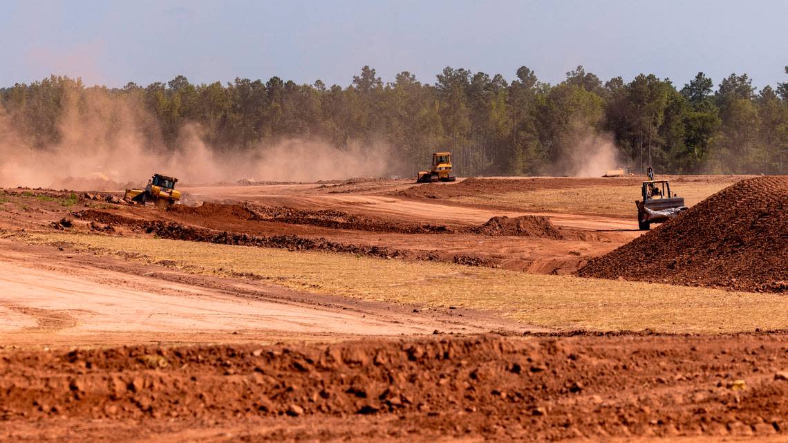 Bulldozers prepare the site for a new Vinfast production facility Friday, July 28, 2003 in Moncure.