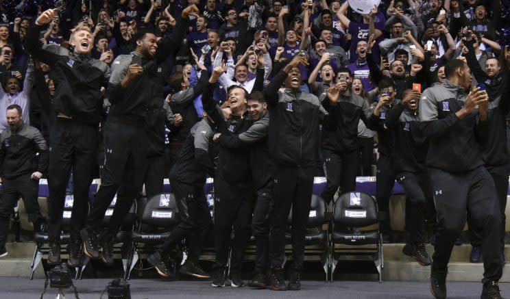 Northwestern players and coaches celebrate their NCAA tournament bid. (Getty)