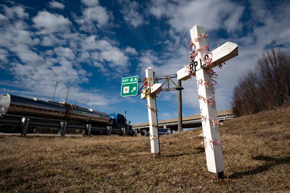 Memorial crosses are seen decorated along Interstate 64 on February 13, 2024 in Lake St. Louis, Missouri.