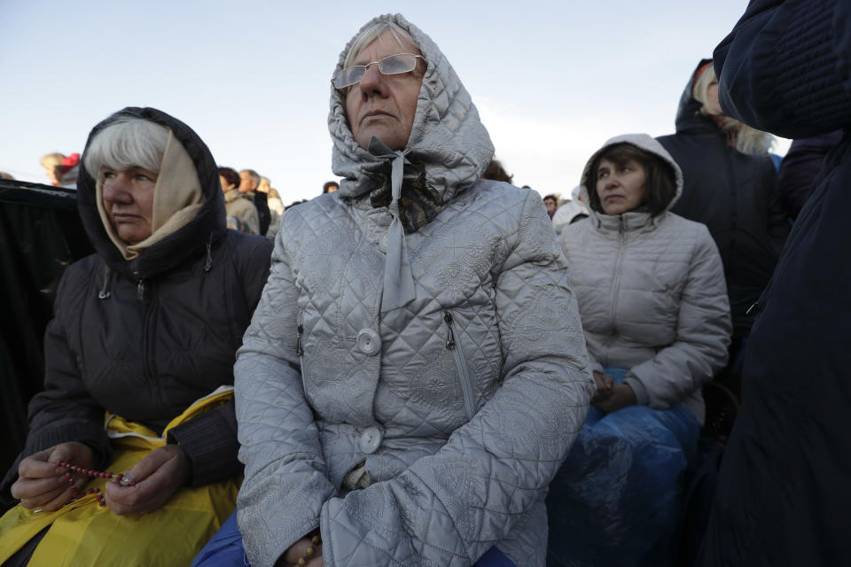 Faithful wait for the arrival of Pope Francis to celebrate mass, at the Santakos Park, in Kaunas, Lithuania, Sunday, Sept. 23, 2018. (AP Photo/Andrew Medichini)