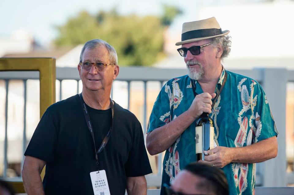 Tower Bridge Dinner founding chefs Randall Selland, left, and Patrick Mulvaney talk during the event on the Tower Bridge between Sacramento and West Sacramento on Sunday.