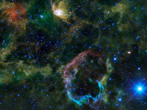 Photo by: NASA/JPL-Caltech/WISE Team<br>Jellyfish nebula-<br>This WISE images shows IC 443, also known as the jellyfish nebula, which is located 5,000 light-years away from Earth inside the Gemini constellation. About 5,000 to 10,000 years ago, a massive star at the center exploded, forming a jellyfish-shaped shell around its remains.