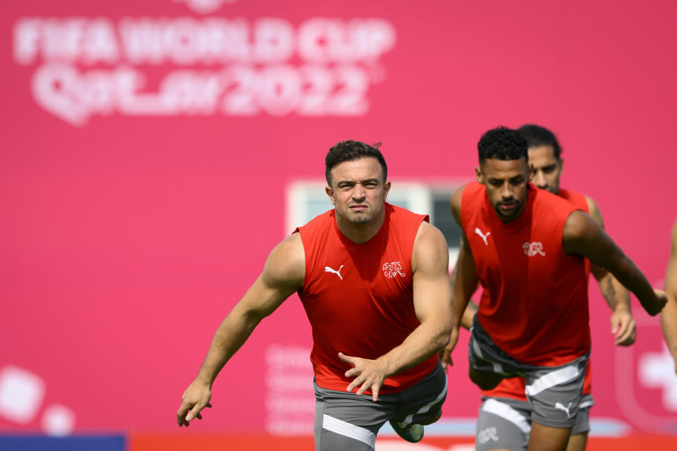 Switzerland's midfielder Xherdan Shaqiri, left, and Switzerland's midfielder Djibril Sow, right, attend a closed training session of Swiss national soccer team on the eve of the FIFA World Cup Qatar 2022 soccer match against Serbia at the University of Doha for Science and Technology training facilities, in Doha, Qatar, Thursday, Dec. 1, 2022. The Swiss national soccer team plays in group G of the FIFA World Cup Qatar 2022. (Laurent Gillieron/Keystone via AP)