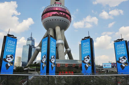 FILE PHOTO: Signs promoting the upcoming China International Import Expo (CIIE) are seen in front of the Oriental Pearl Tower at Lujiazui financial district in Pudong, Shanghai, China October 11, 2018. REUTERS/Stringer