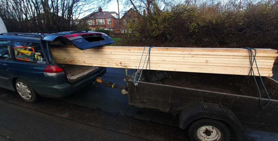 The planks of wood were left hanging over the trailer behind the vehicle. (Twitter/@@WYP_LeedsWest)