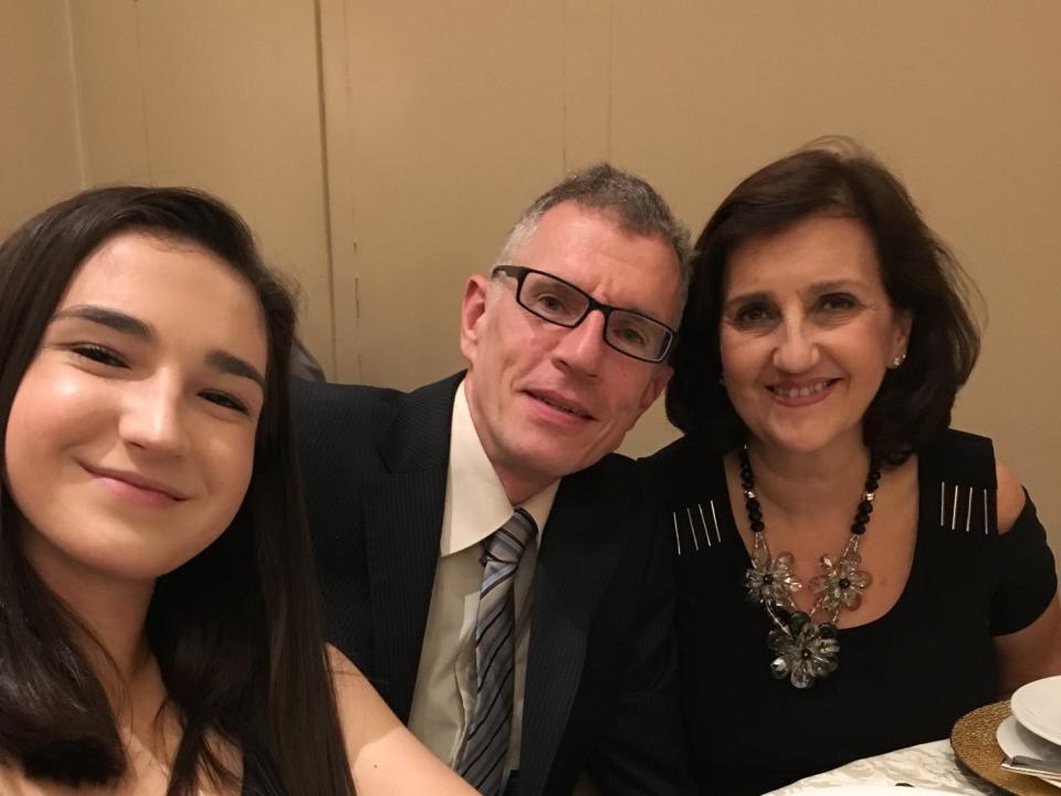 Sandrine Jacquot with her mom and dad at dinner.