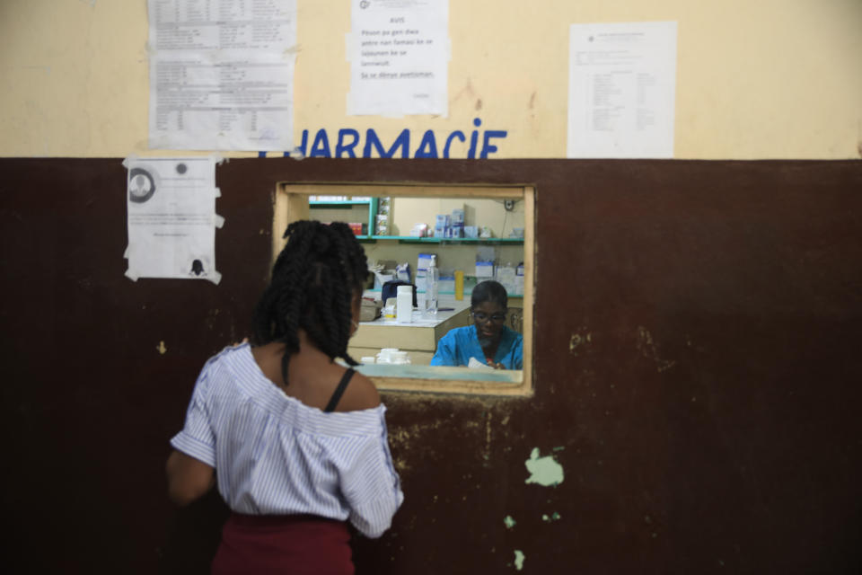 A person waits for medicine at the pharmacy inside Fontaine Hospital Center in the Cité Soleil area of Port-au-Prince, Haiti, Monday, Jan. 23, 2023. As gangs tighten their grip on Haiti, many medical facilities in the Caribbean nation's most violent areas have closed, leaving Fontaine as one of the last hospitals and social institutions in one of the world's most lawless places. (AP Photo/Odelyn Joseph)